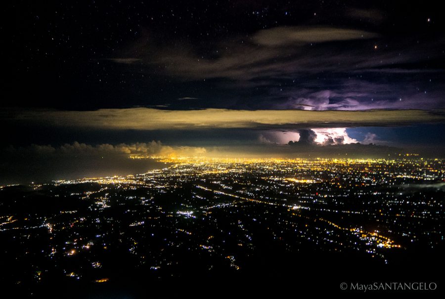 My tripod-less attempt at a slow shutter speed capture of the view halfway up (2 hours/1500m) Mt Agung - city lights, stars and lightning at 4am.